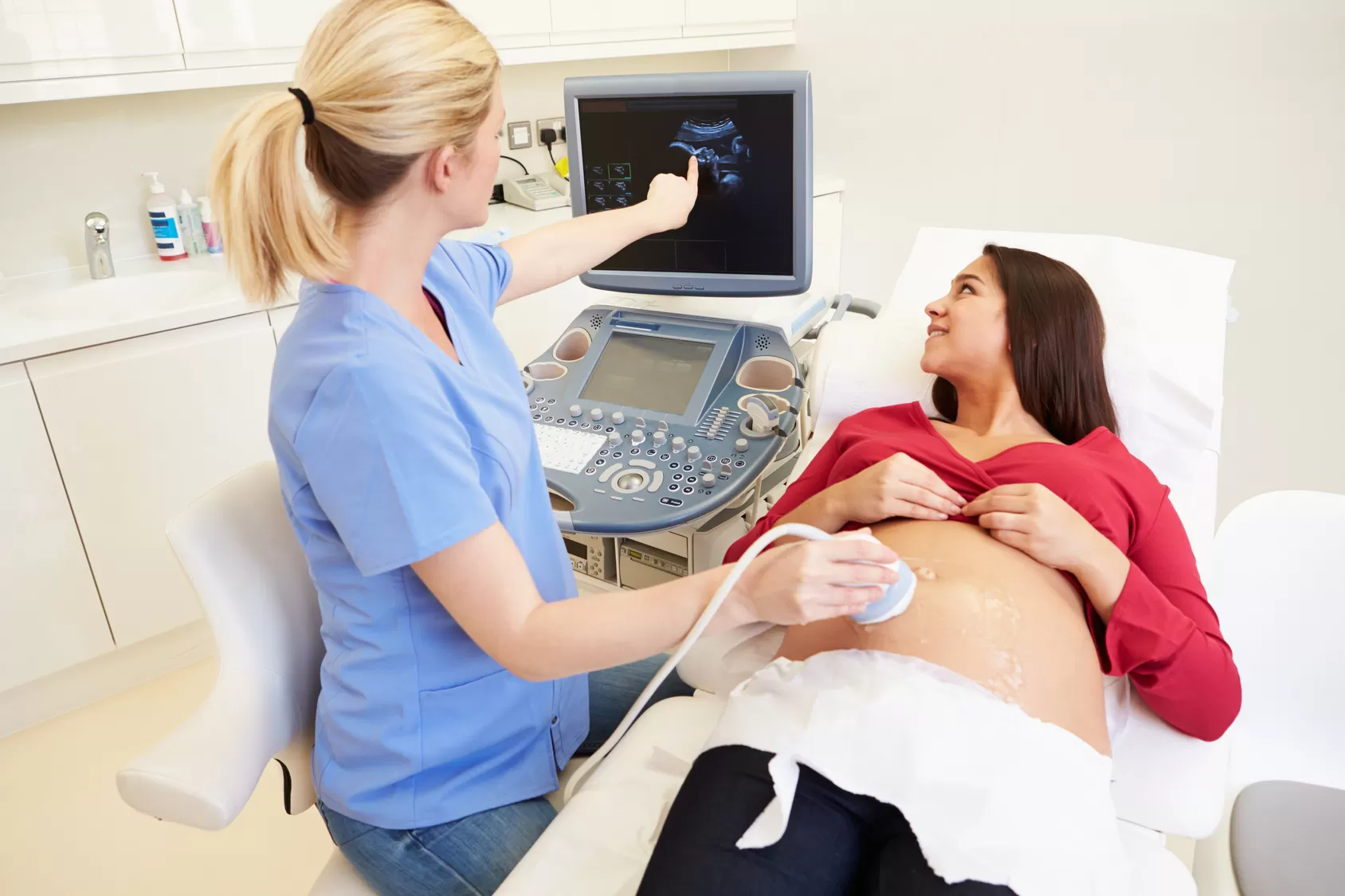 Pregnant Woman Having 4D Ultrasound Scan Pregnant Woman Having 4D Ultrasound Scan